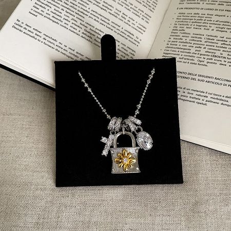 Elegant silver-plated brass chain necklace with an intricately designed padlock pendant.