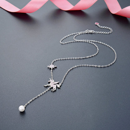 A silver necklace featuring a central pearl pendant flanked by delicate star charms.