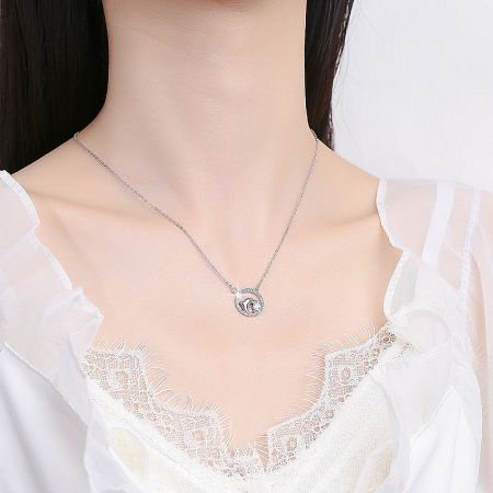 The 925 sterling silver dolphin necklace displayed gracefully, showing its full chain and pendant.