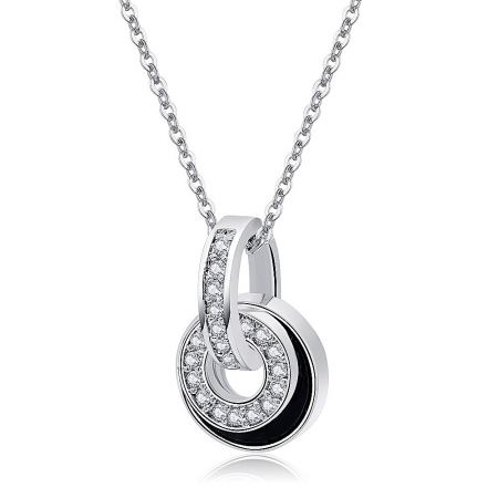Detailed view of the double circle pendant with encrusted cubic zirconia stones.