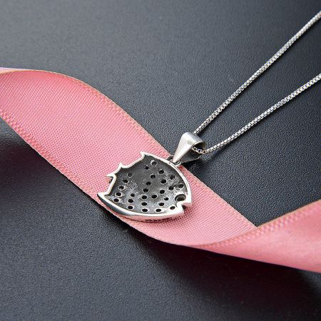 A fun and unique 925 sterling silver necklace with a colorful watermelon slice pendant.