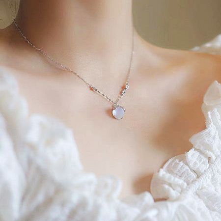 Close-up of the firefly resin stone pendant necklace.