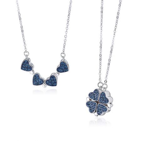 A detailed view of the two wearing options for the blue gemstone necklace, highlighting the clover and heart pendants.