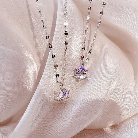Two classic six-claw zircon necklaces displayed together, highlighting the set.