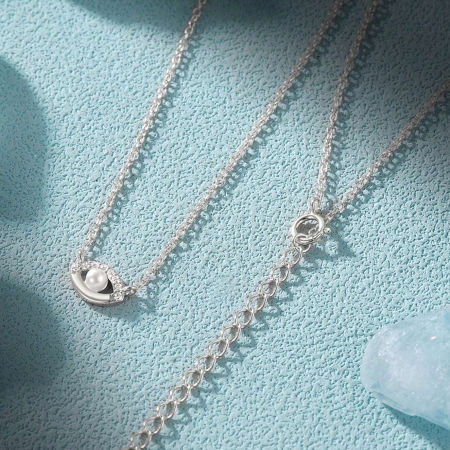The silver finish option of the evil eye necklace set.