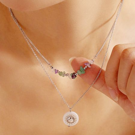 Stainless Steel Beach Style Sun Pendant Layered Necklaces Set - A set of two stainless steel layered necklaces, one with colorful rock beads and the other with a delicate sun pendant, displayed on a neutral background.