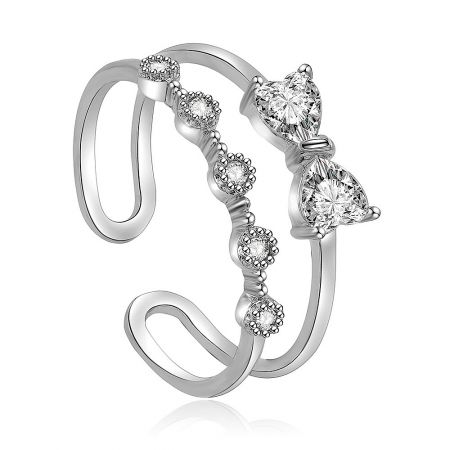 Love Adjustable Bow Ring - A close-up of the Love Adjustable Bow Ring, showcasing its rhodium-plated brass band and intricate bow design set with sparkling white cubic zirconia stones.
