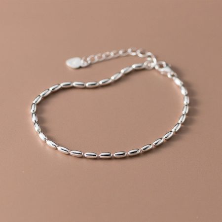 Product shot of the Simple Beauty Rice Beaded Bracelet in 925 sterling silver against a neutral background.