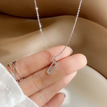 The 925 sterling silver oval CZ zircon pendant necklace in a classic silver finish.