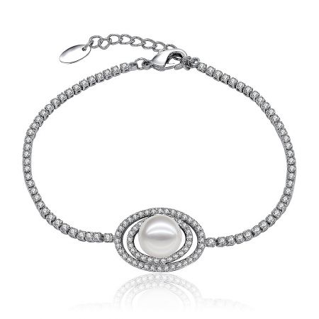Pave CZ Oval Pearl Charm Bracelet - Close-up of the Pave CZ Oval Pearl Charm Bracelet, showcasing the central white shell pearl surrounded by sparkling cubic zirconia stones on a rhodium-plated brass chain.