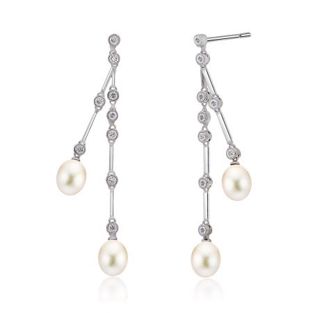 Detailed view of the matching pearl and cubic zirconia stud earrings.