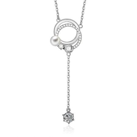 A detailed view of the double-circle pendant with its intricate cubic zirconia setting and elegant pearl drop.