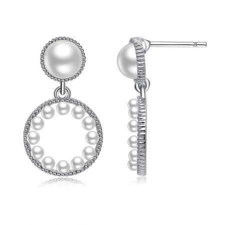 Detailed view of the Pearly Baby Earrings highlighting the combination of large and small pearls.