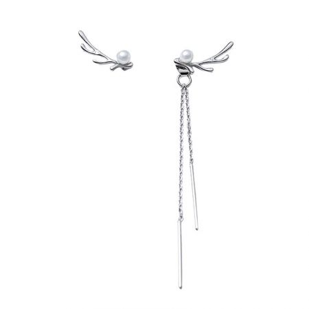 Close-up of the silver-plated version of the pearl and antler earrings, showcasing the intricate design.
