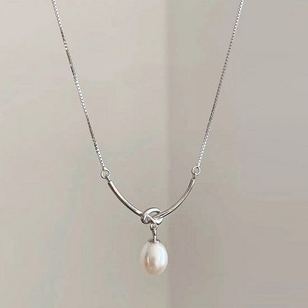 Silver Plated Knot-Drop Pearl Pendant Necklaces (Set of 5) - A close-up of an elegant silver-plated knot-drop pearl pendant necklace, displayed on a neutral background.