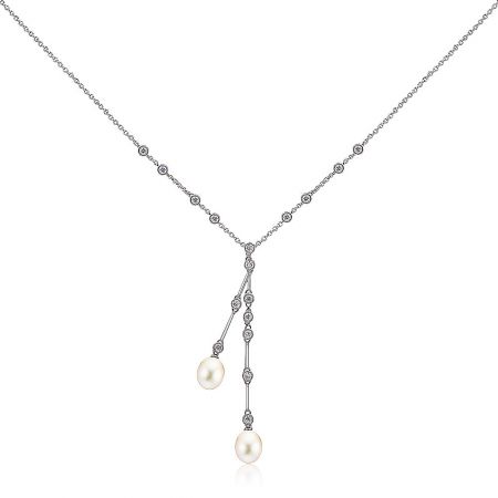 Close-up of the Y-shaped pearl necklace pendant with cubic zirconia accents.