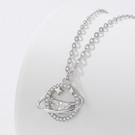 A planetary-themed 925 silver pendant necklace adorned with a large clear gemstone and decorative elements.
