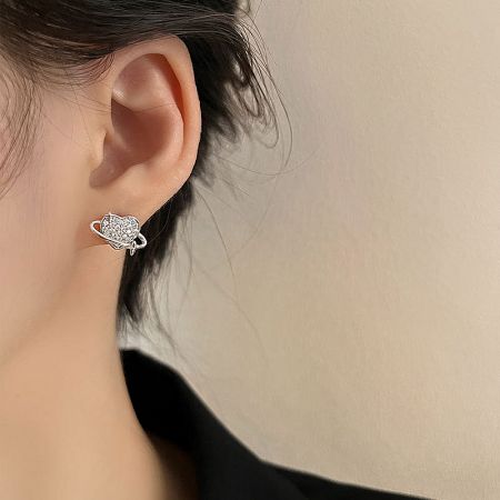 Close-up of the silver planetary stud earring with crystal ring.
