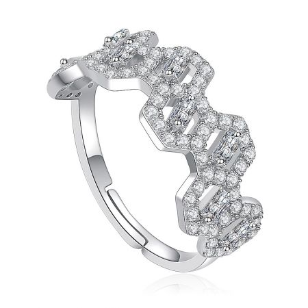 Side profile of the stylish brass ring, showing the puzzle-piece design and brilliant cubic zirconia.