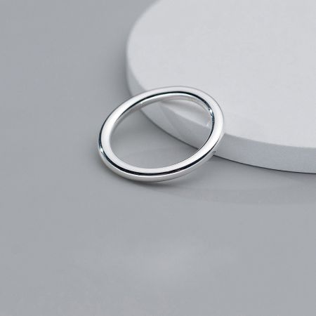 A single 925 sterling silver ring displayed to showcase its classic and simple band design.