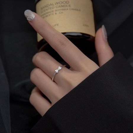 Model wearing the S925 silver bow ring, showcasing its elegant fit.