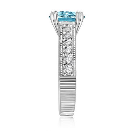 Angled perspective of the Aquamarine Solitaire Ring, emphasizing the brilliance of the central blue gemstone and its surrounding accents.