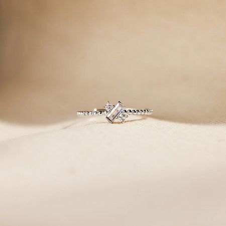 Another angle of the zircon ring, emphasizing its modern geometric pattern.