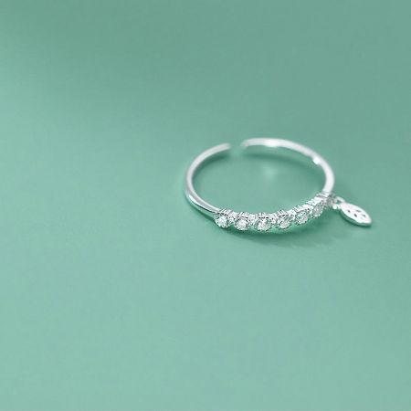 Another perspective of the adjustable silver ring, showcasing its delicate and shimmering design.