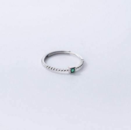 The 925 sterling silver emerald ring shown in a silver finish with anti-tarnish e-coating.