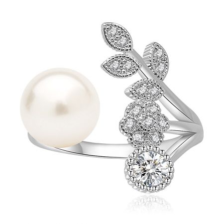 Adjustable Pearl Allure Ring - Adjustable Pearl Allure Ring featuring a large white pearl and a cubic zirconia encrusted floral design on a rhodium-plated band.
