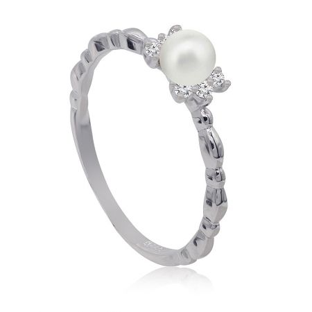 A side view of the elegant pearl and CZ band ring, highlighting its delicate design.