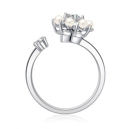 Side view of the Silver Spinning Pearl Ring, highlighting its distinctive crown-like design with pearls and clear gemstones.