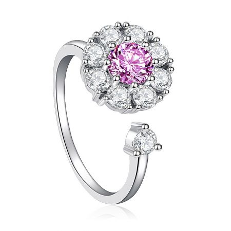 Side view of the Pinky Flower Spinning Ring, highlighting the intricate setting of the pink and clear cubic zirconia stones.
