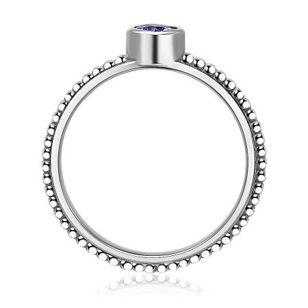 Angled perspective of the Silver Delicate Purple Heart Ring, emphasizing the sparkle and cut of the purple gemstone.