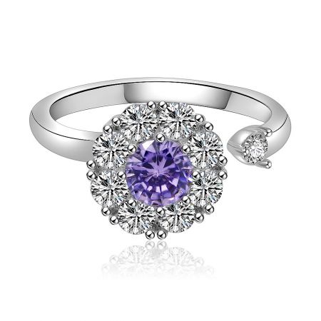 Adjustable Spinning Purple Floral Ring - Front view of the Adjustable Spinning Purple Floral Ring, showcasing the central purple cubic zirconia surrounded by a halo of clear stones on a rhodium-plated brass band.