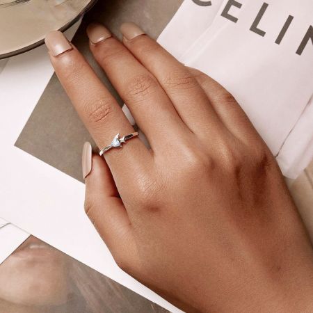 A sterling silver ring from the set featuring a delicate star design with a central gemstone.