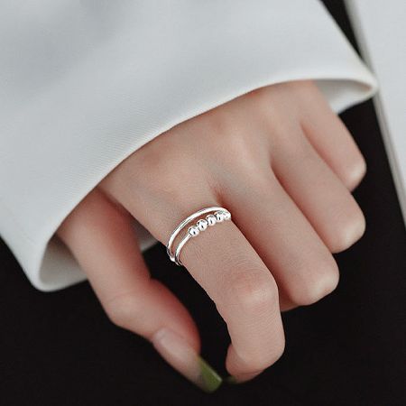 Elegant shot of the anxiety rings worn on a female hand.