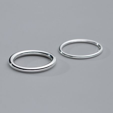 Two sterling silver stack rings shown together to illustrate how they can be paired for a layered look.