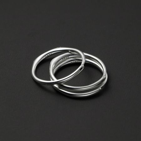 Detailed product shot of three sterling silver alphabet rings showing the quality craftsmanship.