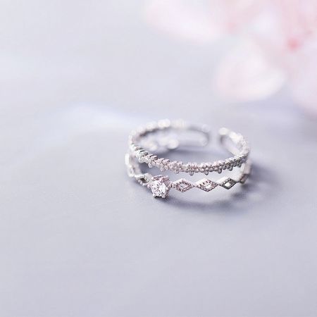 Two S925 silver adjustable rings with sparkling CZ zircon stones on a white background.