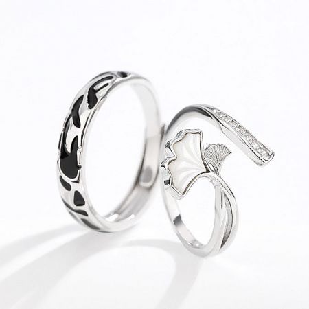 Close-up of the adjustable ginkgo couple rings, showing detailed craftsmanship on a silver band.
