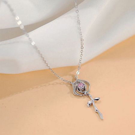 Another perspective of the silver rose pendant, emphasizing the craftsmanship and sparkle of the pink zircon.