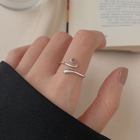 Close-up of the 925 sterling silver snake ring worn on a finger, highlighting its adjustable open design.