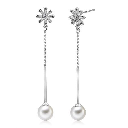 A pair of silver snowflake pearl earrings displayed against a white background.