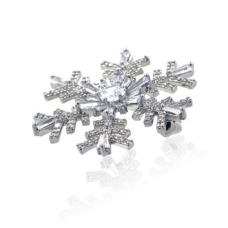Top-down view of the sparkling snowflake crystal brooch, perfect for Christmas and winter wedding themes.
