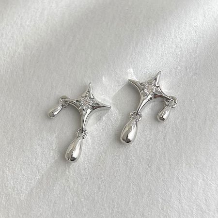 A pair of silver star-shaped earrings with sparkling clear CZ zircon gemstones and elegant teardrop charms against a white background.