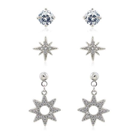 3 Pairs Dainty Small Rhodium Post Earrings - A set of three dainty rhodium-plated post earrings, including a single CZ stud, a star stud, and a drop star design with cubic zirconia.