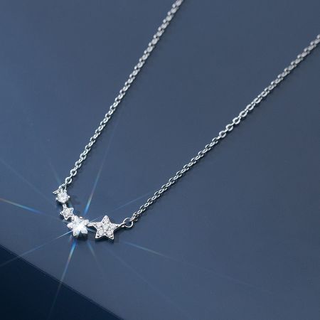 925 Sterling Silver Dainty Zircon Star Pendant Necklace Set of 5 - A close-up of the 925 Sterling Silver Dainty Zircon Star Pendant Necklace, showcasing its sparkling star-shaped design.