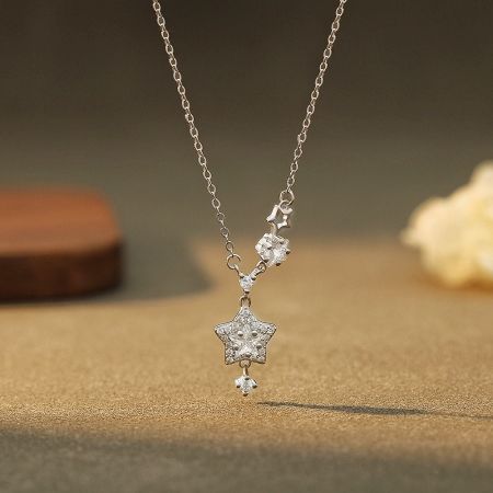 999 Sterling Silver Dainty Star Necklace - Set of 5 - A delicate 999 sterling silver necklace with a sparkling star-shaped pendant on a clean white background, showcasing its celestial design.
