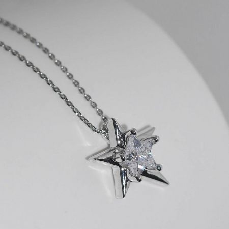 925 Sterling Silver Platinum Plated Irregular Star Pendant Necklace - A close-up of the 925 sterling silver irregular star pendant necklace, plated with platinum and featuring a central sparkling zircon stone, on a clean white background.